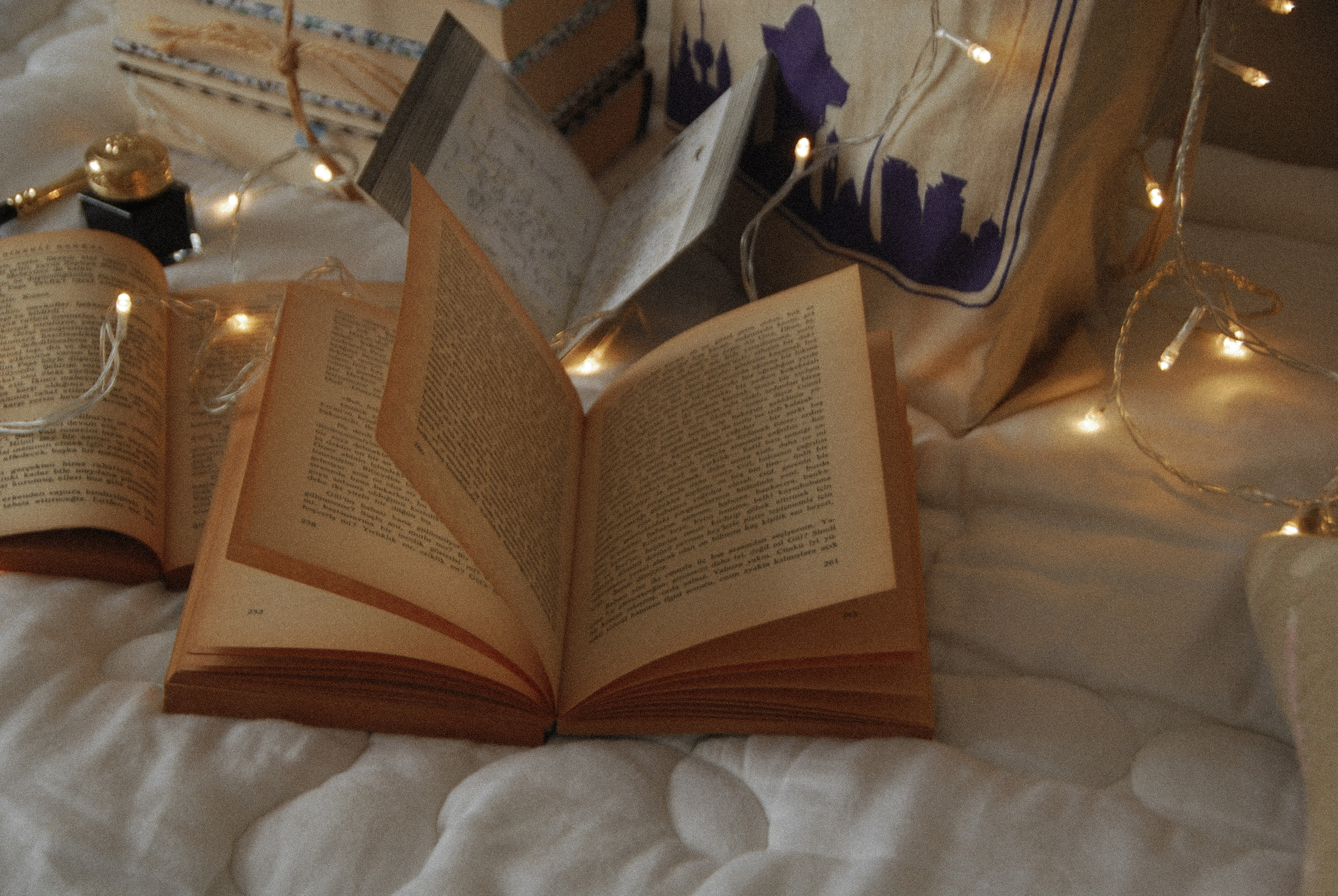 Open Books on a Bed